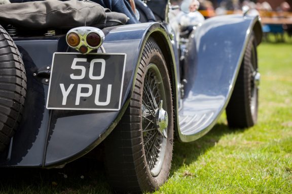 Classic blue car with a visible rear wheel and number plate reading "50 YPU".