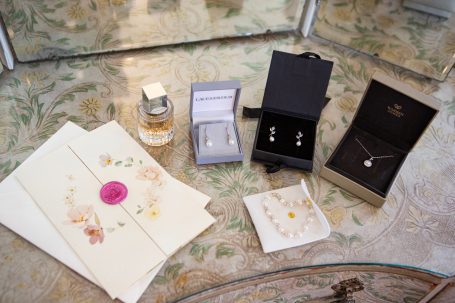 Brides perfume, wedding invites and jewellery. 