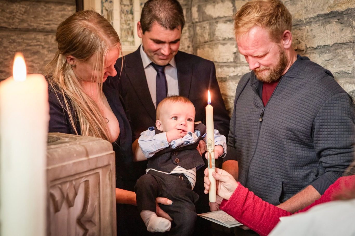 Automotive water pump with a grey metallic finish and central spindle.